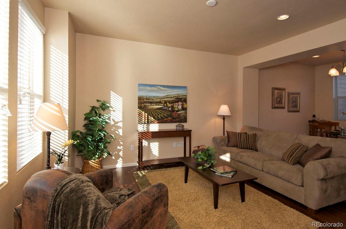10296 Bellwether Lane Lone Tree, CO 80124 - Photo 5 of 29 a living room with furniture and a fireplace