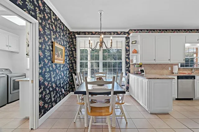 a kitchen with stainless steel appliances a sink stove and cabinets