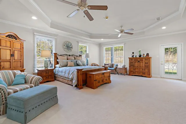 a bathroom with a sink a potted plant and a shower