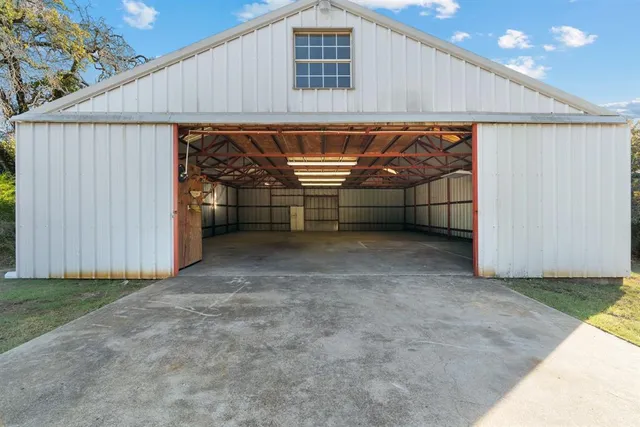a view of field with trees in the background