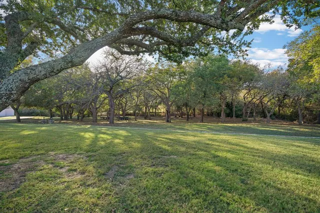 an aerial view of a house with a swimming pool