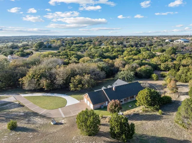 an aerial view of a houses with outdoor space