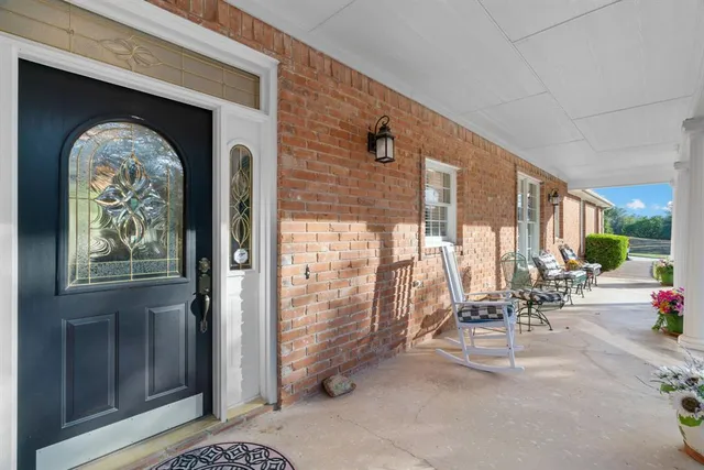 a kitchen with a stove and a painting on the wall