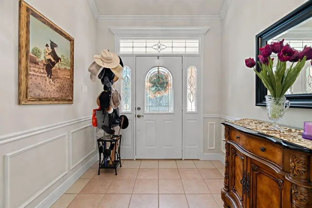 a view of entryway and hall with dining room