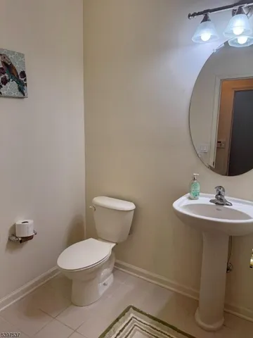 a bathroom with a sink and a window