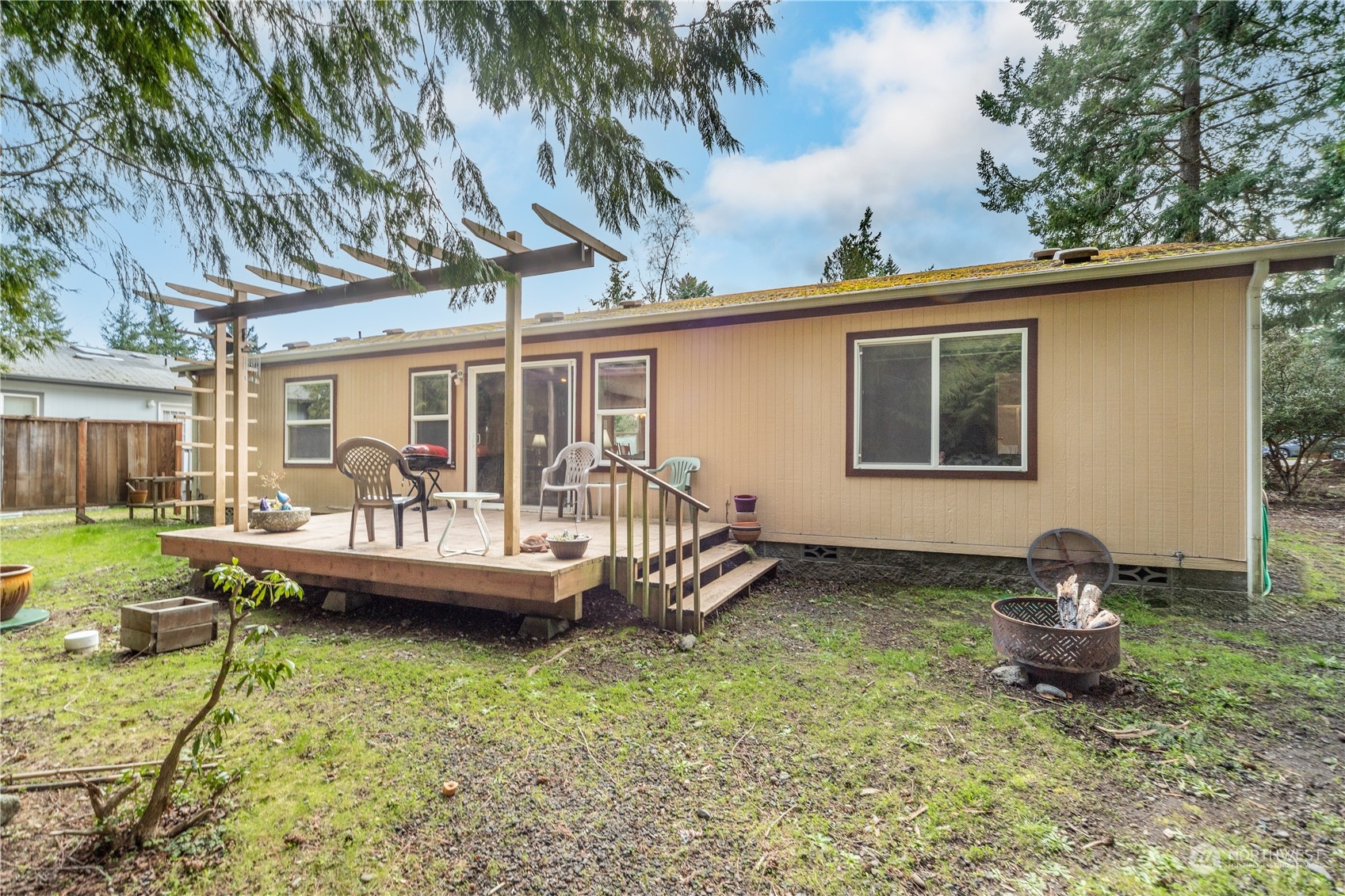 384 Port Hadlock Heights Road Port Hadlock, WA 98339 - Photo 21 of 25 a view of a house with backyard sitting area and garden