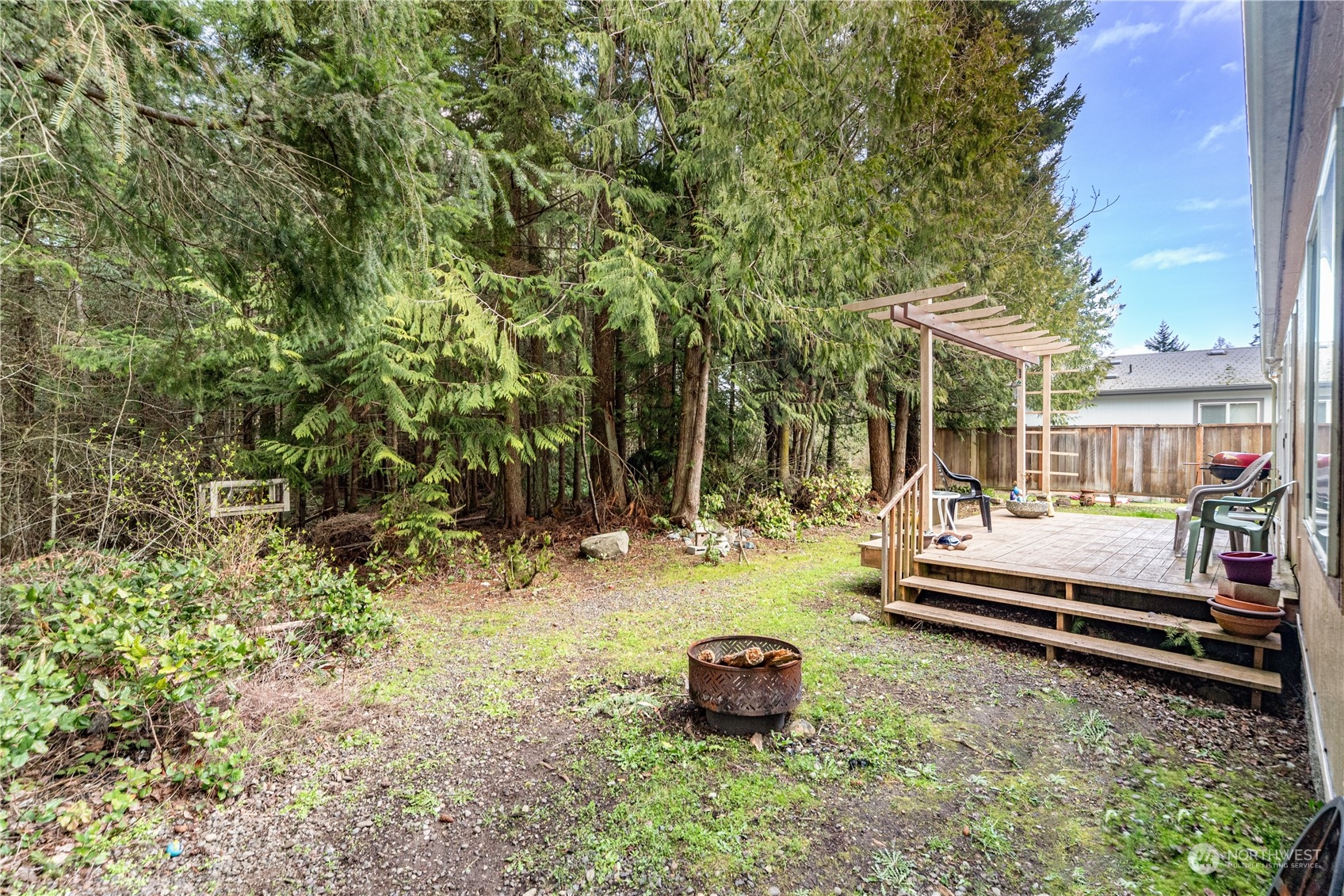 384 Port Hadlock Heights Road Port Hadlock, WA 98339 - Photo 3 of 25 a view of a yard with furniture and wooden fence