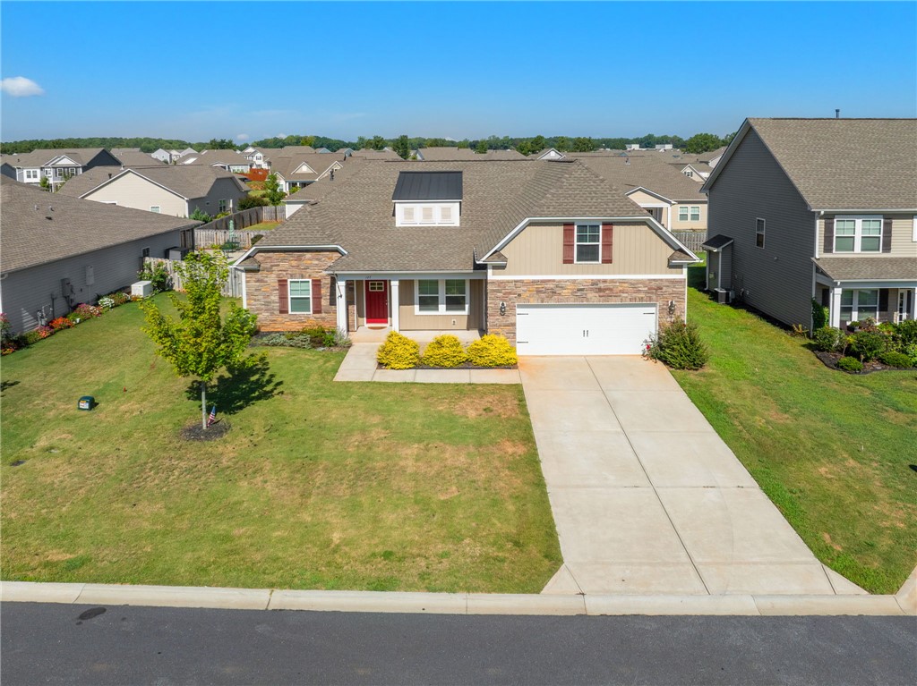 127 Spyglass Lane Pendleton, SC 29670 - Photo 2 of 45 An inviting stone and siding exterior frames this modern home featuring a spacious concrete driveway.