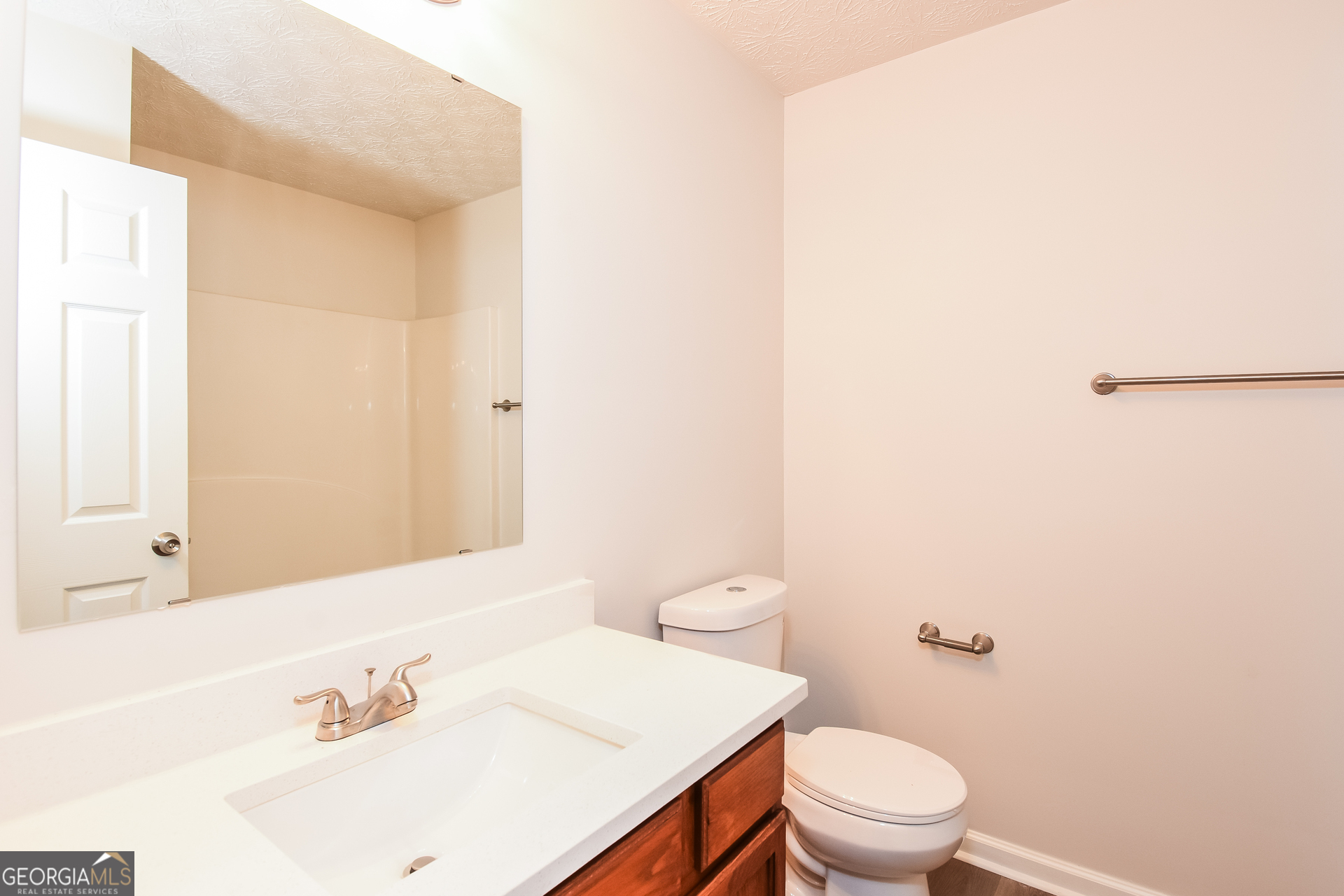 343 Alderman Trace Southwest Austell, GA 30168 - Photo 13 of 17 a white toilet sitting next to a bathroom sink