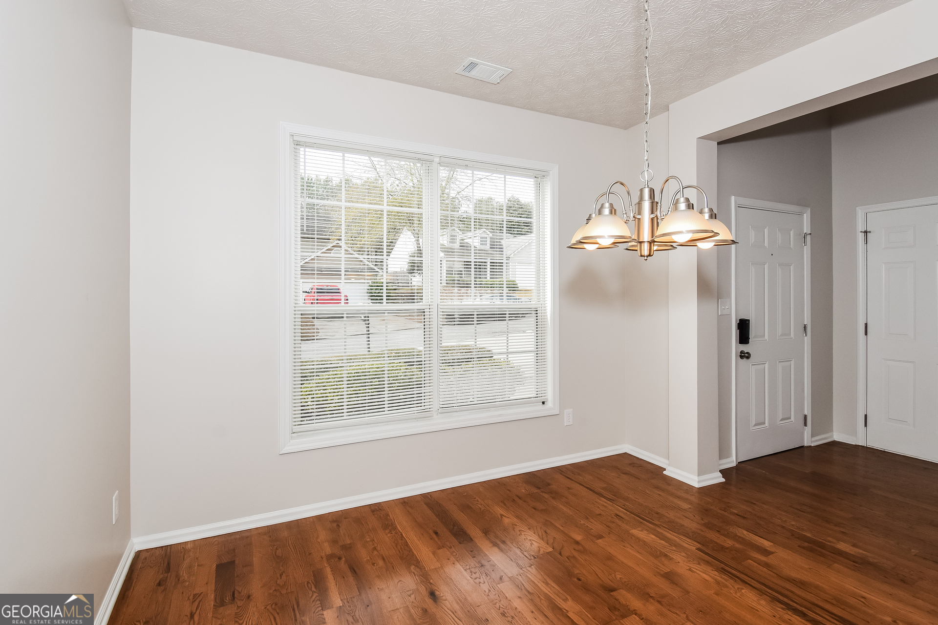 343 Alderman Trace Southwest Austell, GA 30168 - Photo 6 of 17 a view of empty room with wooden floor and fan