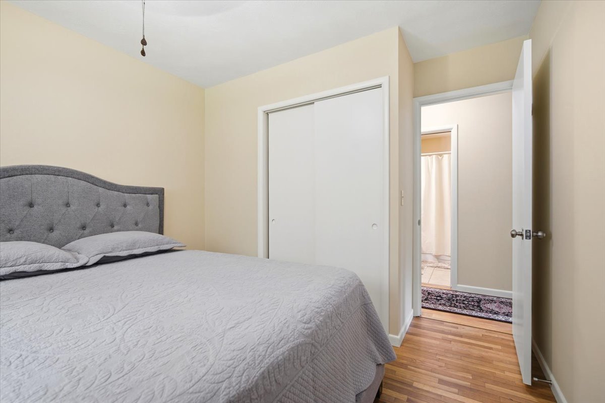 203 Highview Drive Eureka, IL 61530 - Photo 18 of 49 a bedroom with a bed and wooden floor