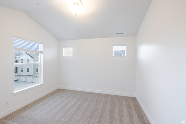 4661 Poplar Way, Unit R304 Mapleton, UT 84664 - Photo 10 of 17 Unfurnished room featuring vaulted ceiling and light carpet