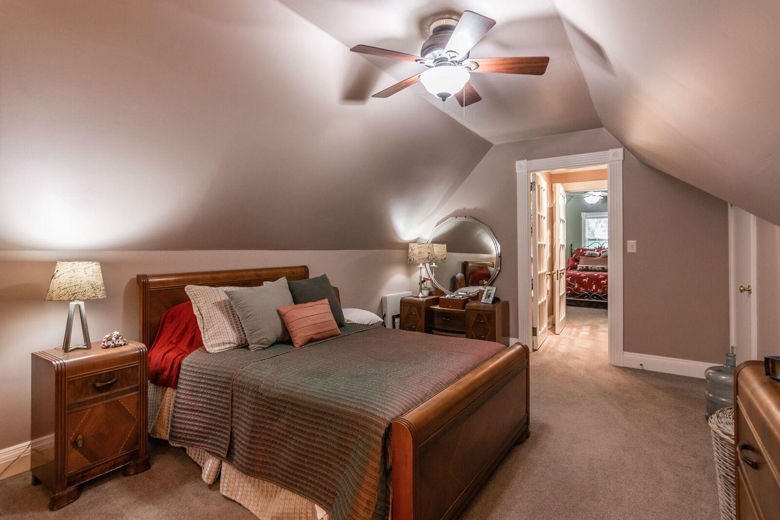 114 Spring Valley Road Nashville, TN 37214 - Photo 17 of 30 a bed room with a bed and a chandelier