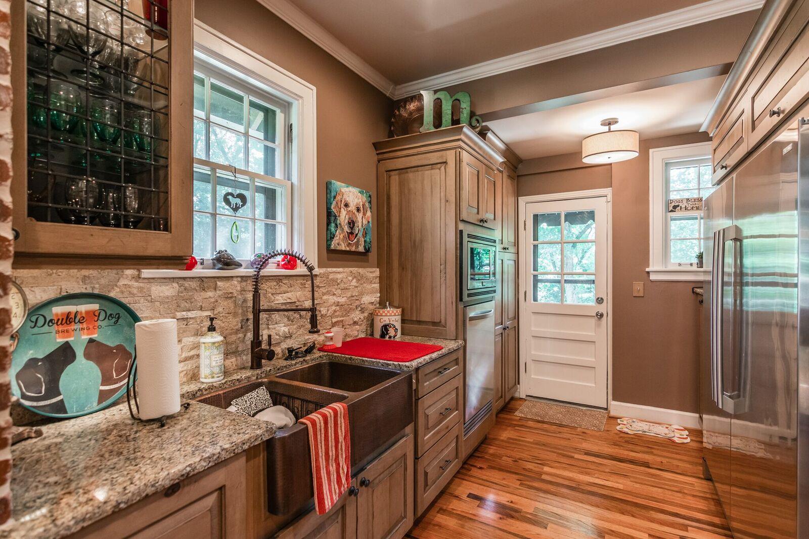 114 Spring Valley Road Nashville, TN 37214 - Photo 6 of 30 a kitchen that has a lot of cabinets