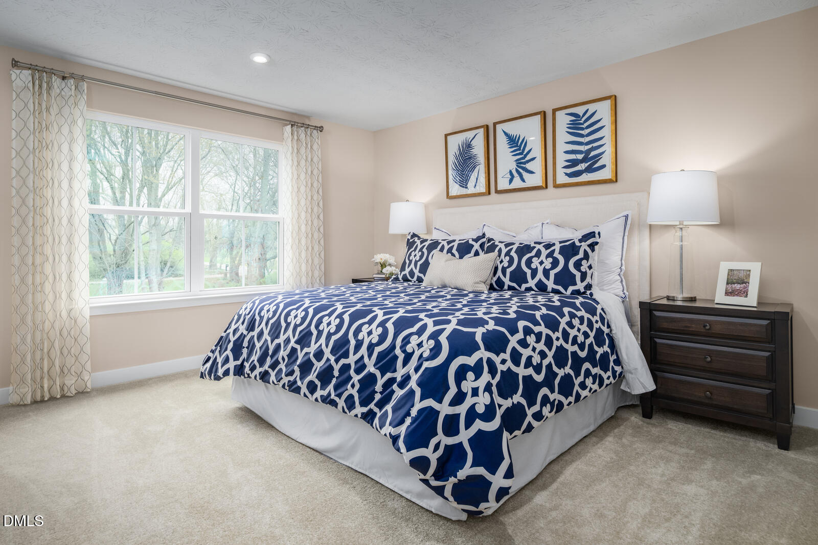 921 Walker Rdg Way Willow Spring, NC 27592 - Photo 13 of 23 a bed sitting in a bedroom next to a window