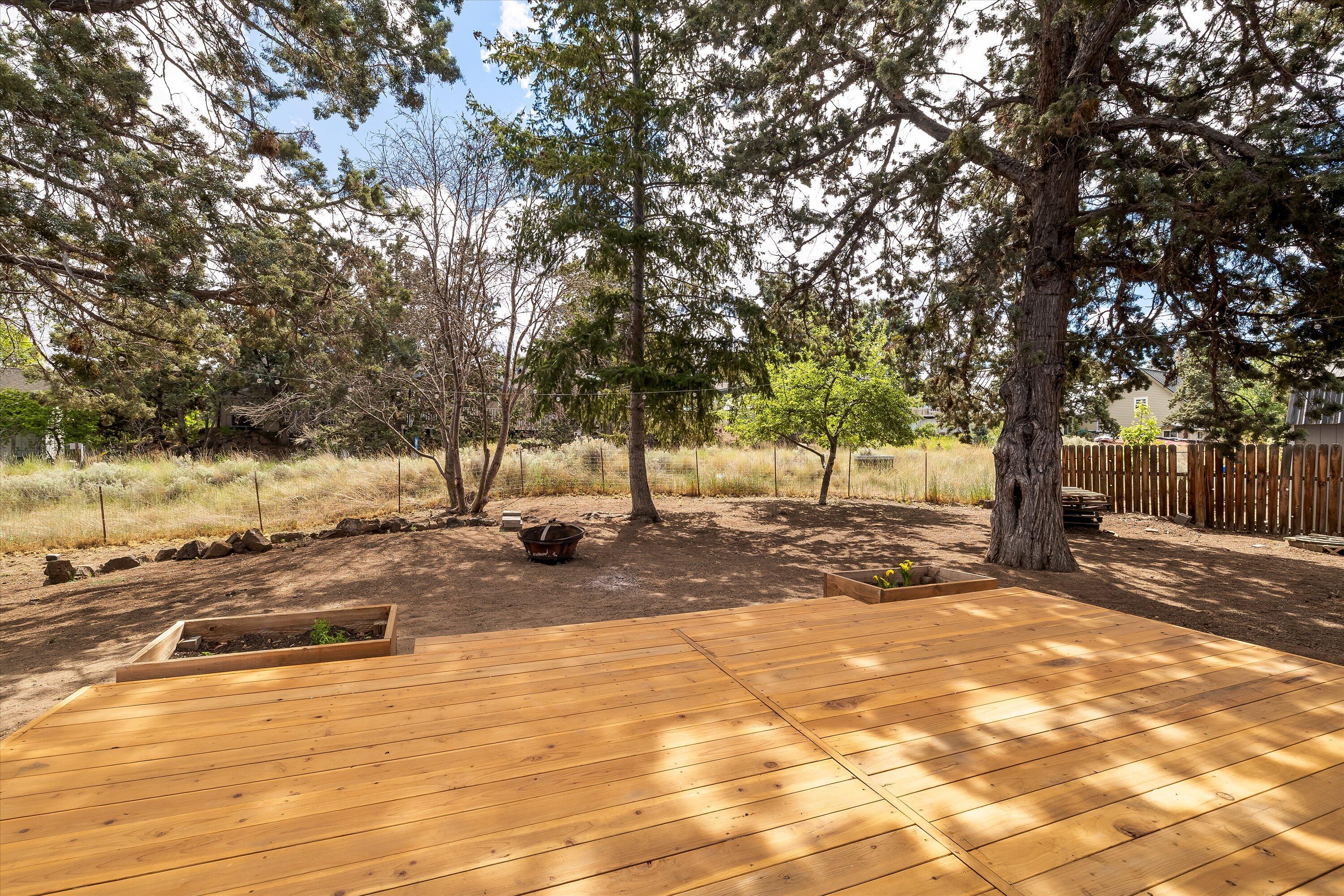 63634 Hunters Circle Bend, OR 97701 - Photo 19 of 28 a view of a yard with trees