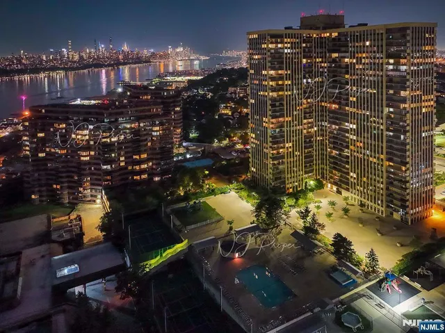 a living room with furniture flat screen tv and a large window