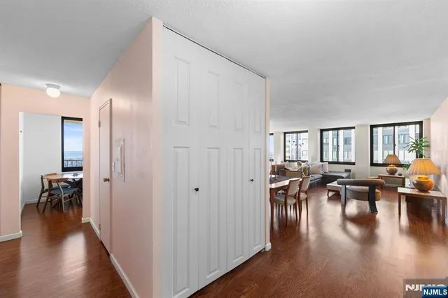 a view of dining room with furniture wooden floor and chandelier