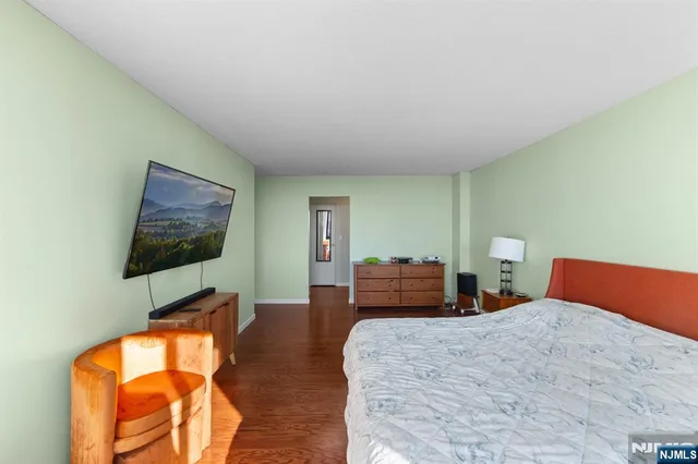 a bedroom with bed and window