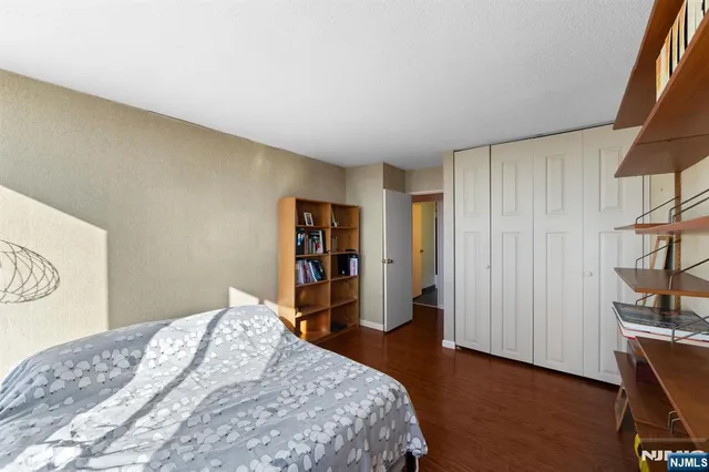 a bedroom with a bed and a closet