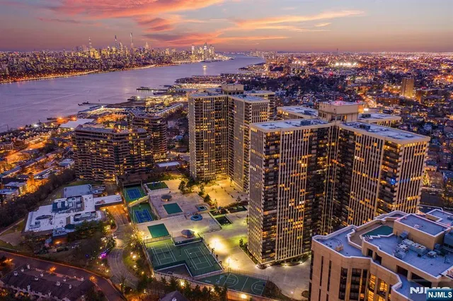 an aerial view of city and lake