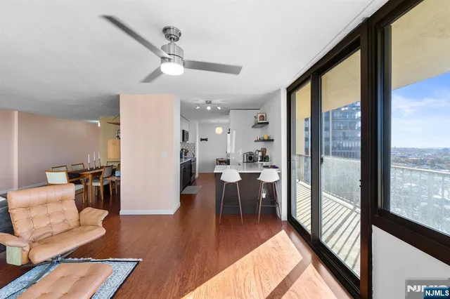 a living room with furniture and a large window