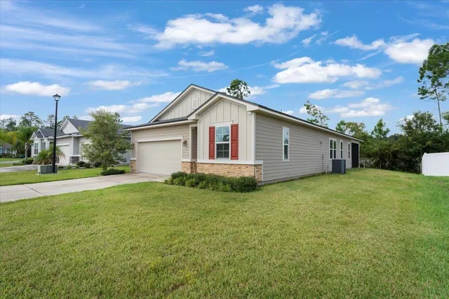 a backyard of a house with lots of green space