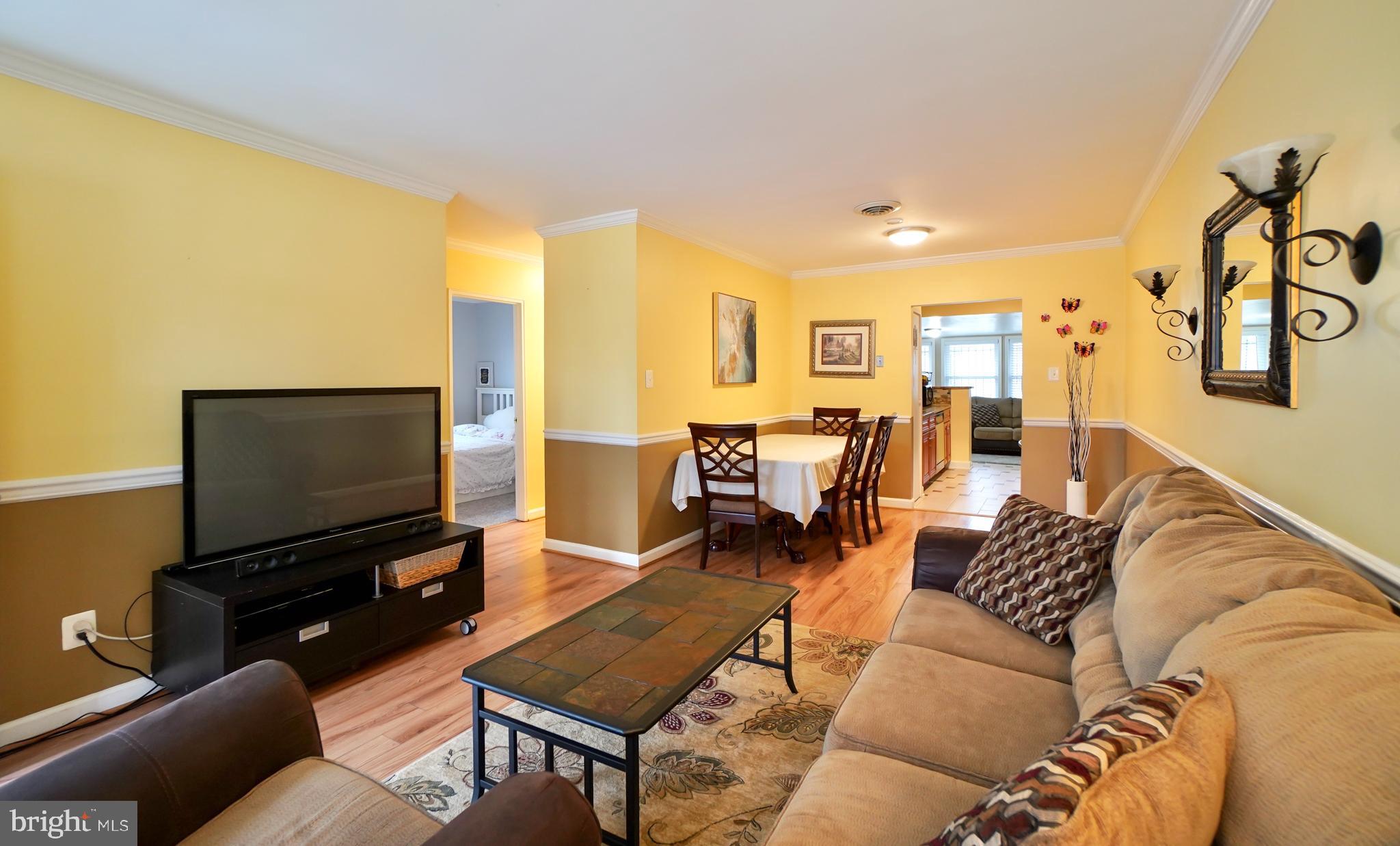7767 Muncy Road Landover, MD 20785 - Photo 4 of 27 a living room with furniture and a flat screen tv