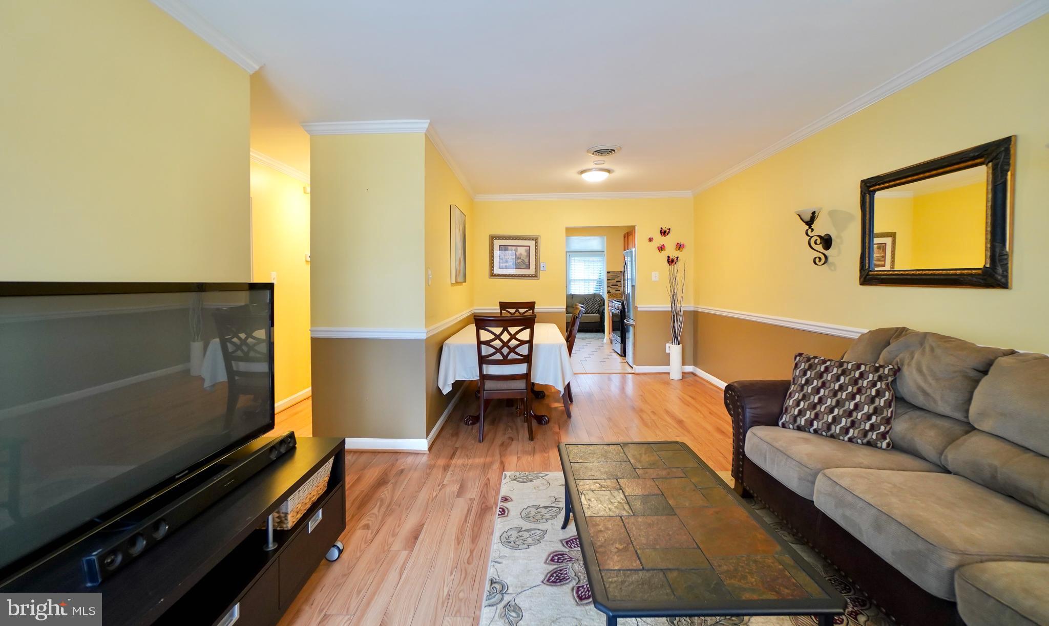 7767 Muncy Road Landover, MD 20785 - Photo 5 of 27 a living room with furniture and a couch