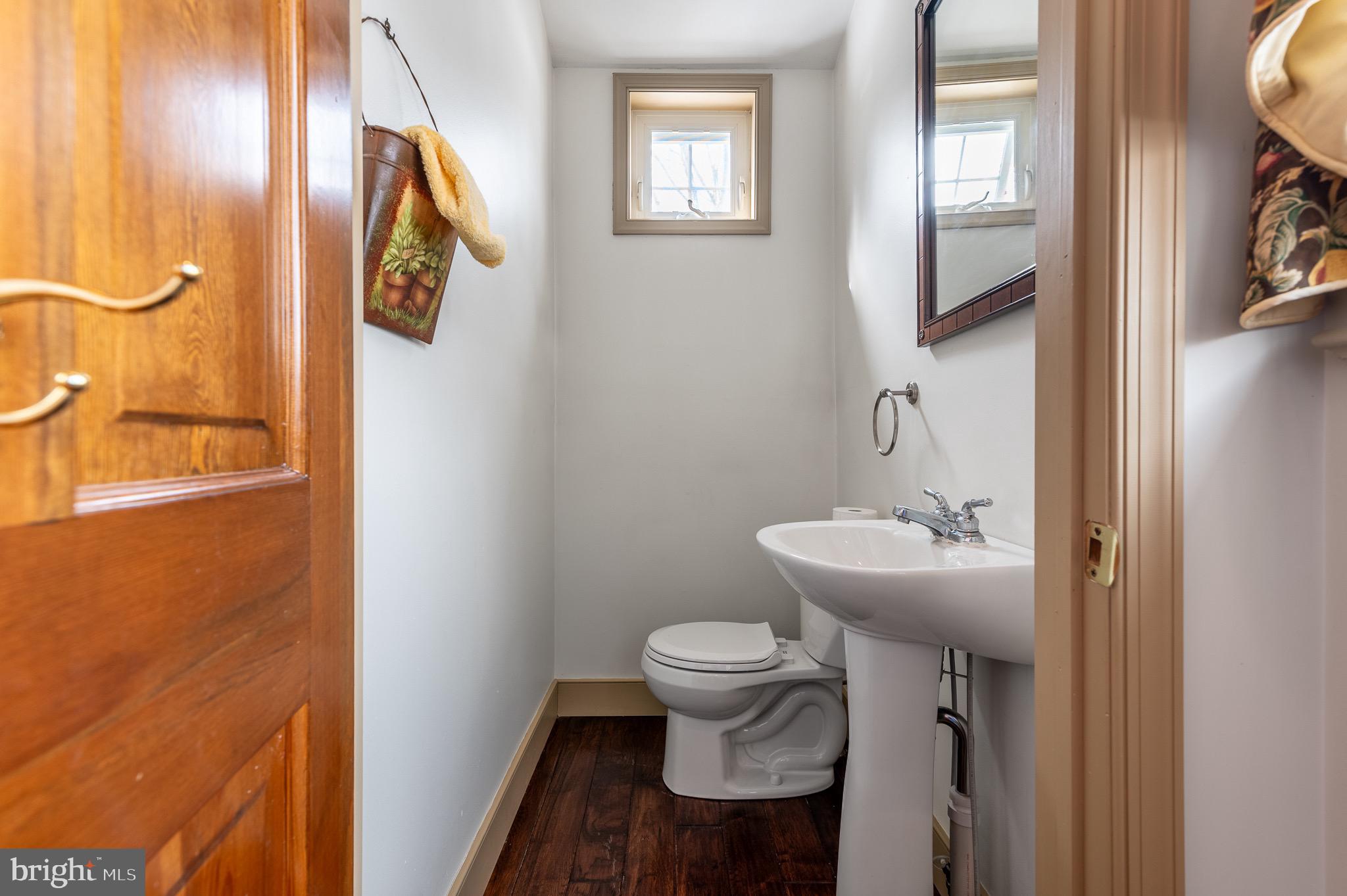 1169 St Matthews Road Chester Springs, PA 19425 - Photo 25 of 73 a bathroom with a sink and mirror with toilet
