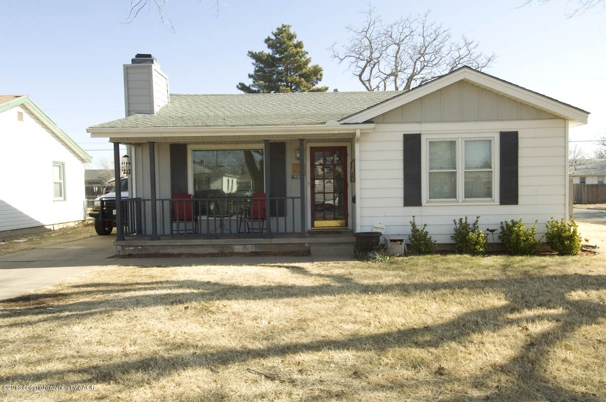 4227 South Jackson Street Amarillo, TX 79110 - Photo 1 of 23 a front view of a house with a yard