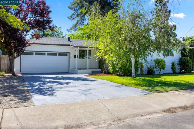 a house view with a backyard space