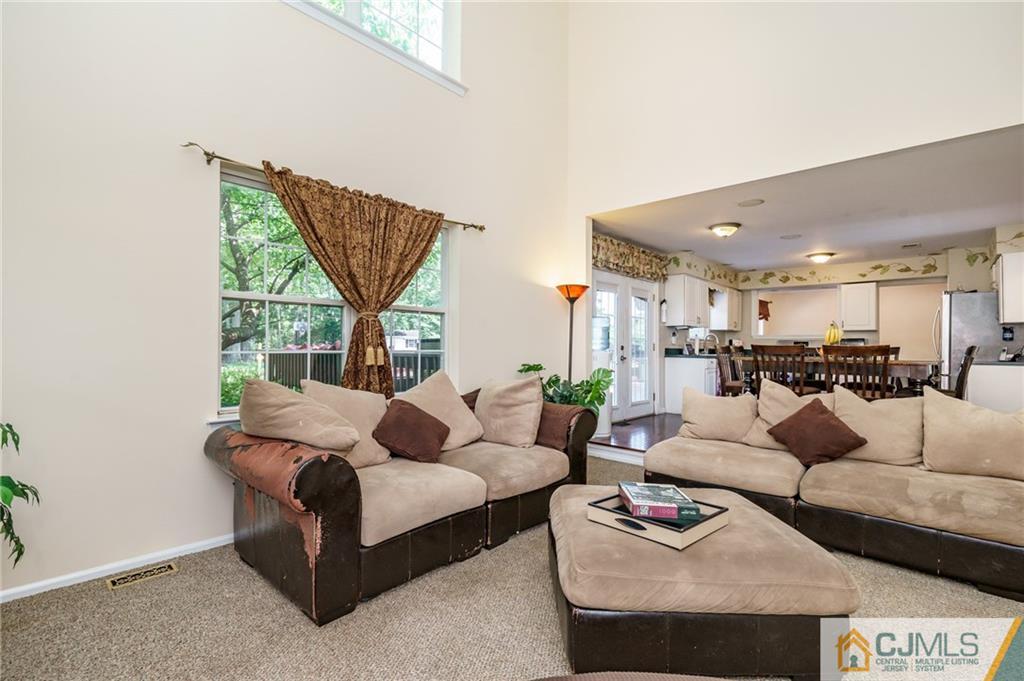 3 Sun Hollow Road Howell, NJ 07731 - Photo 14 of 36 a living room with furniture and a large window