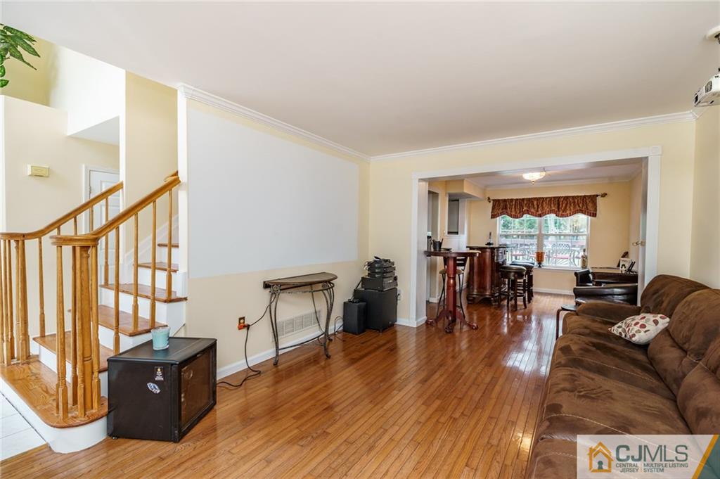 3 Sun Hollow Road Howell, NJ 07731 - Photo 3 of 36 a living room with furniture and wooden floor