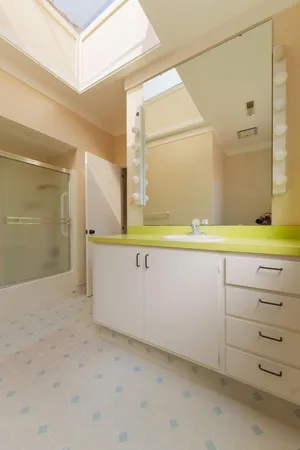 a bathroom with a sink and a mirror