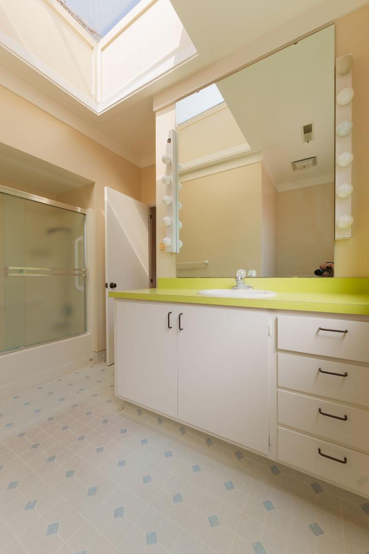 1352 River Road Salinas, CA 93908 - Photo 27 of 33 a bathroom with a sink and a mirror