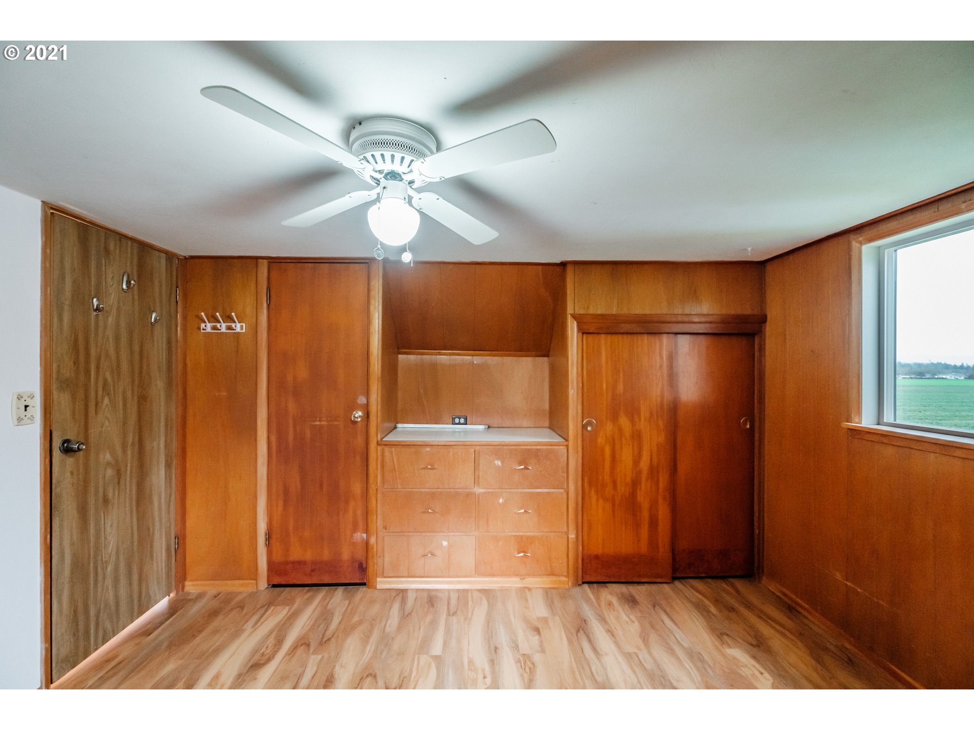1005 Cascade Drive Lebanon, OR 97355 - Photo 25 of 32 a view of an empty room and wooden floor