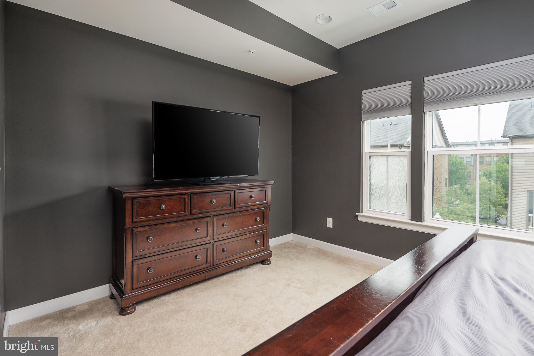 22355 Exe Square Ashburn, VA 20148 - Photo 14 of 65 a living room with furniture and flat screen tv