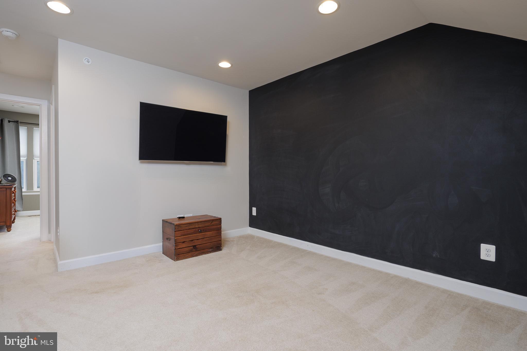 22355 Exe Square Ashburn, VA 20148 - Photo 24 of 65 a living room with a flat screen tv