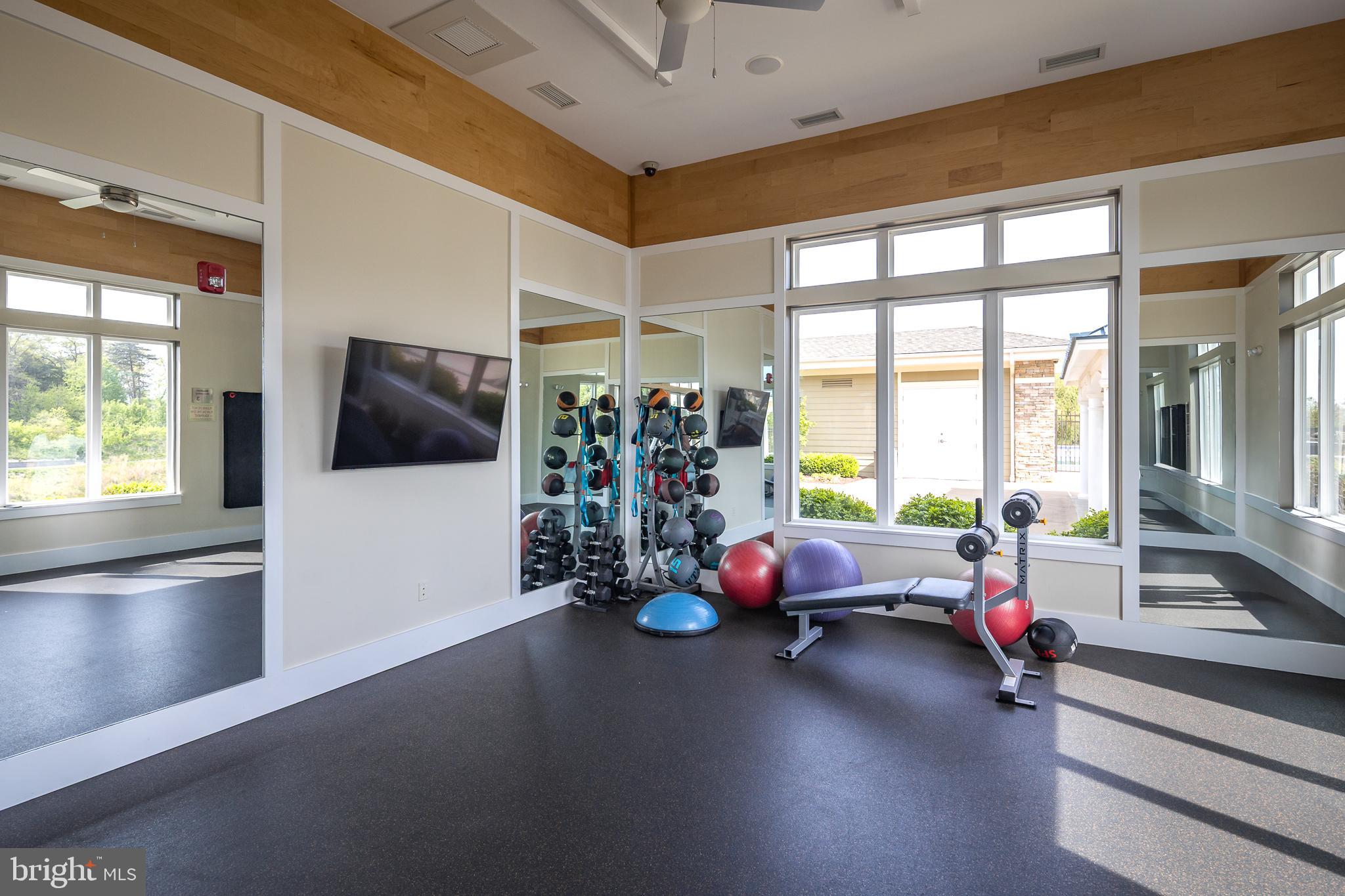 22355 Exe Square Ashburn, VA 20148 - Photo 37 of 65 a room with lots of furniture and a large window