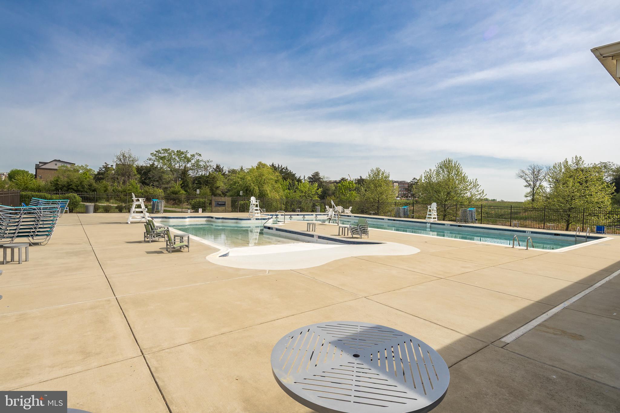 22355 Exe Square Ashburn, VA 20148 - Photo 42 of 65 a view of swimming pool with outdoor seating and yard in the back