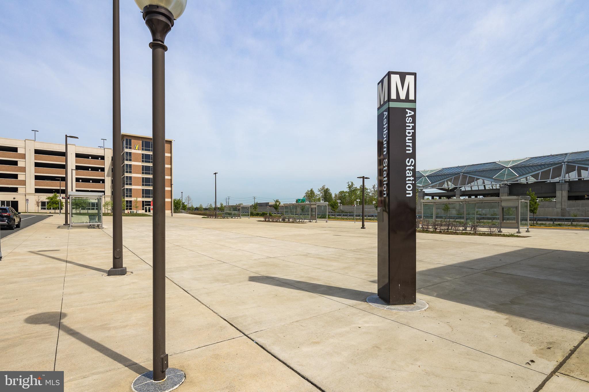 22355 Exe Square Ashburn, VA 20148 - Photo 59 of 65 a sign board next to a road