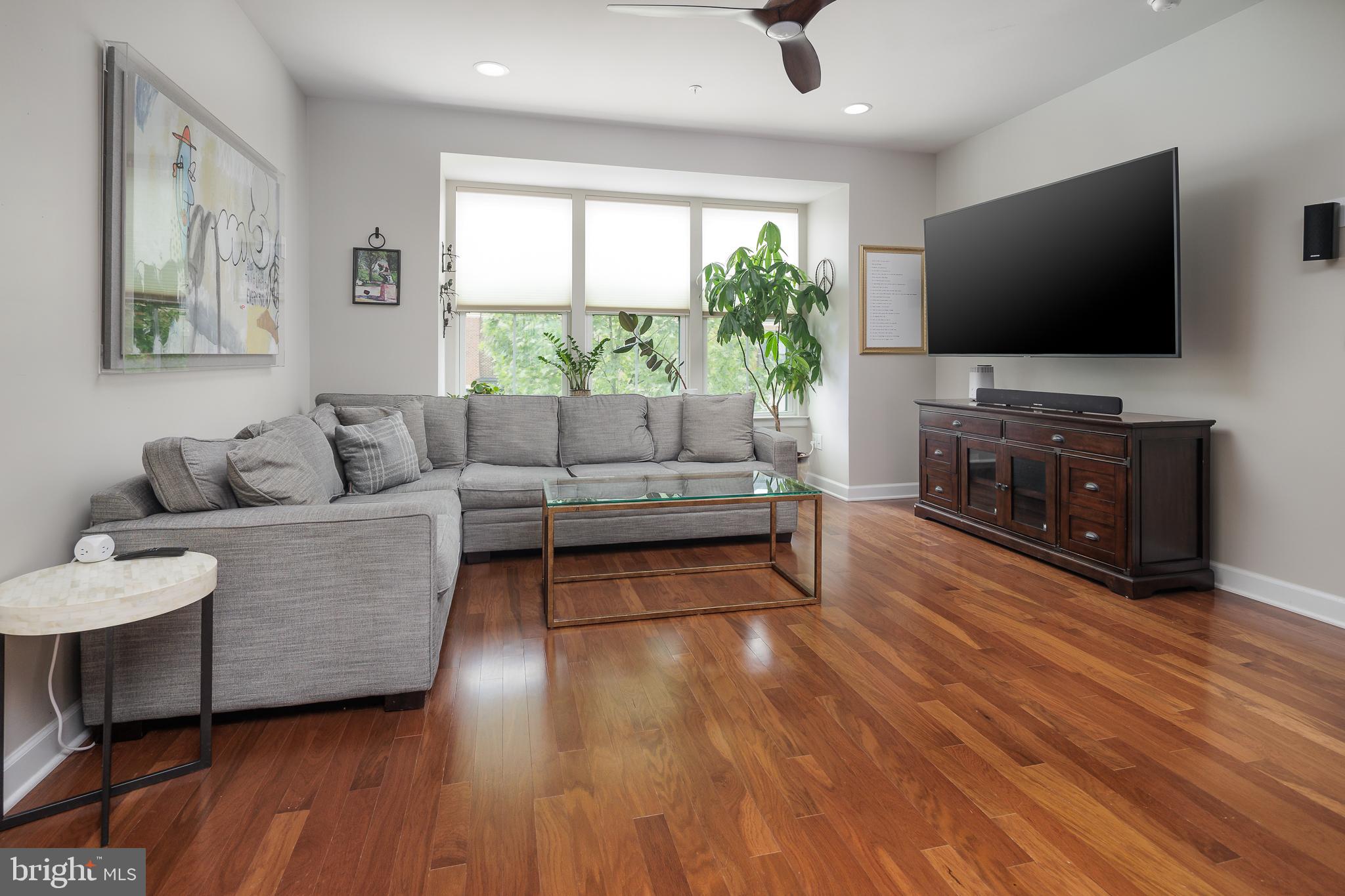 22355 Exe Square Ashburn, VA 20148 - Photo 10 of 65 a living room with furniture and a flat screen tv