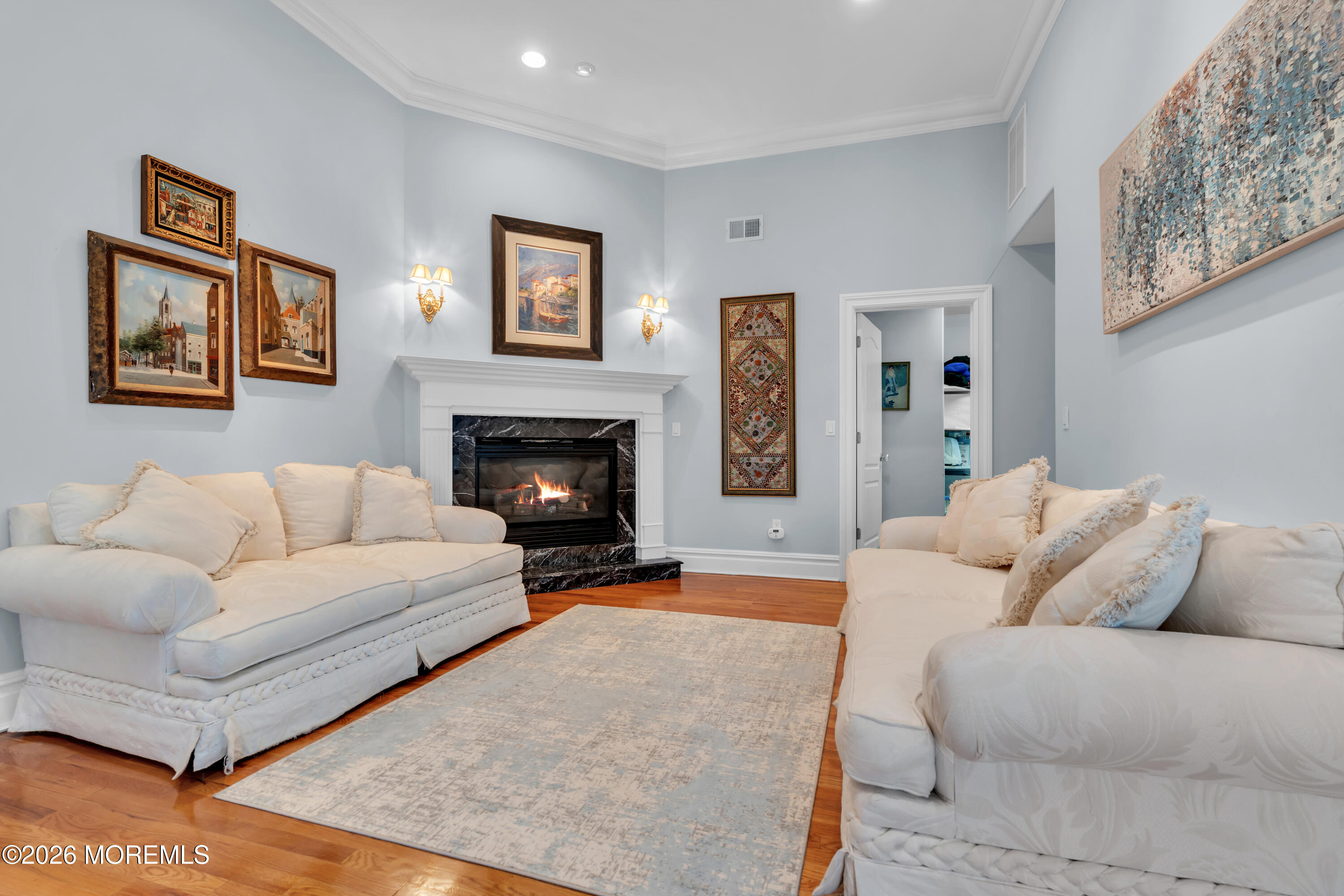 600 Little Silver Point Road Little Silver, NJ 07739 - Photo 30 of 55 a living room with furniture and a fireplace