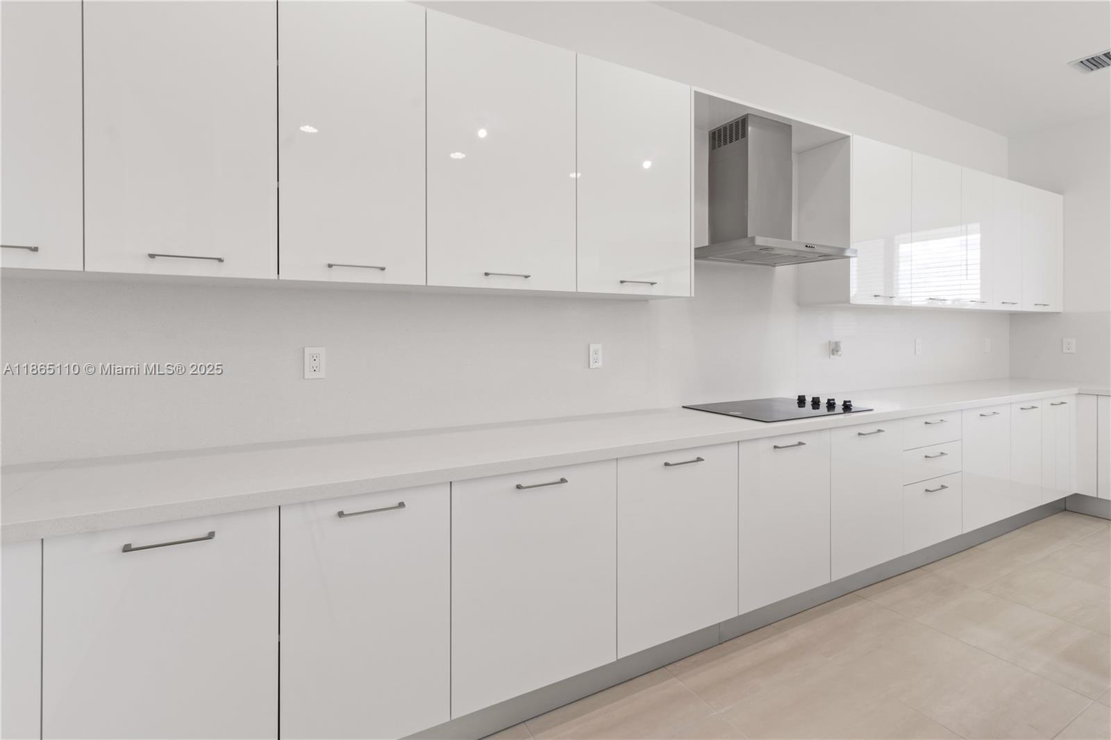 2391 Southwest 123rd Terrace Davie, FL 33325 - Photo 11 of 39 a kitchen with white cabinets and white appliances