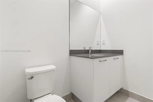 an empty room with a empty space and windows