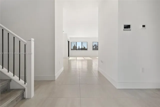 a hallway with a white walls