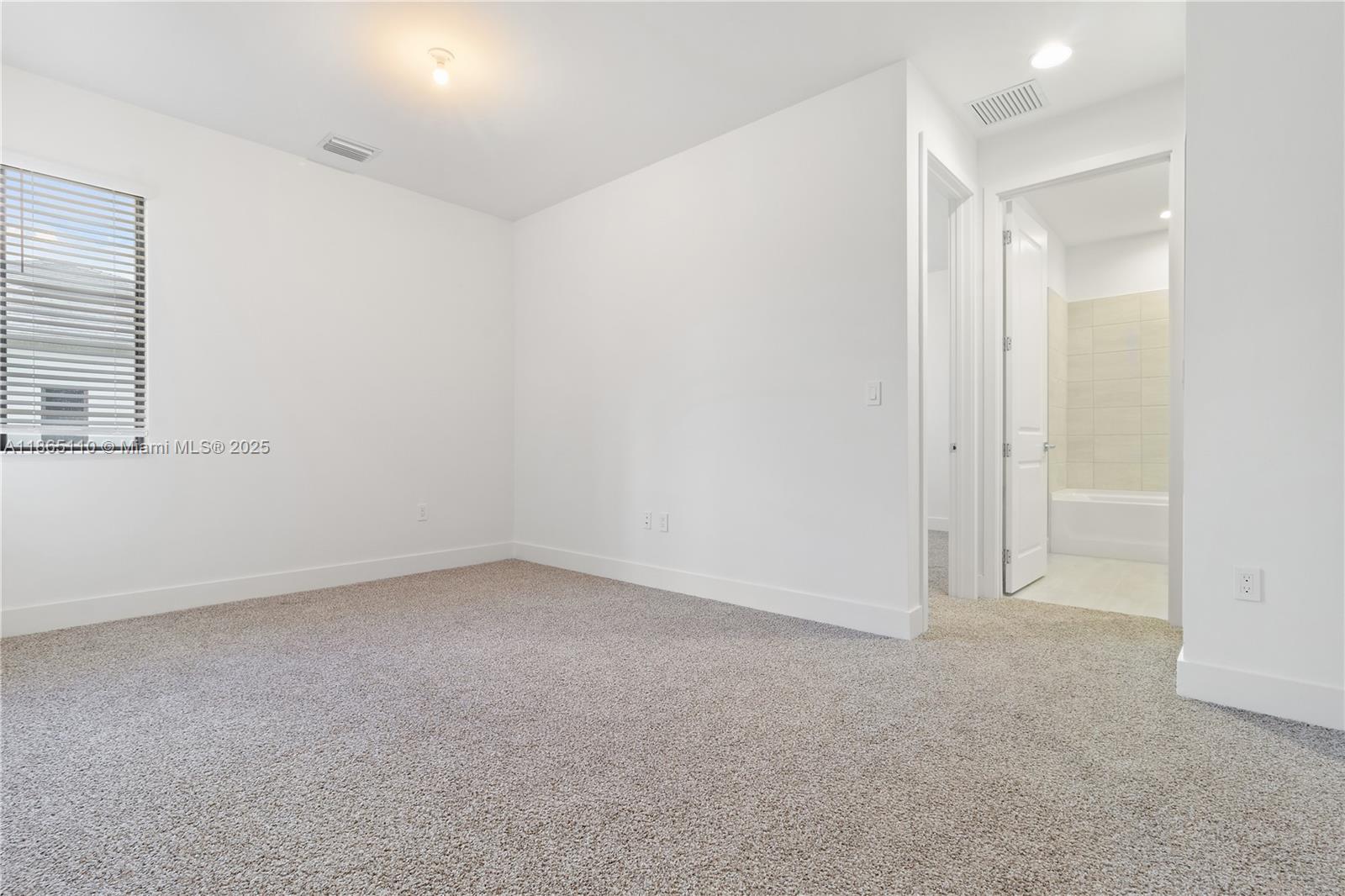 2391 Southwest 123rd Terrace Davie, FL 33325 - Photo 21 of 39 an empty room with a empty space and windows