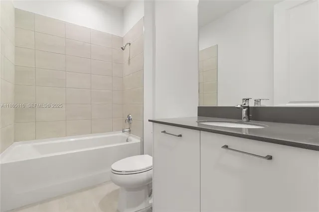 a view of an empty room and fire place