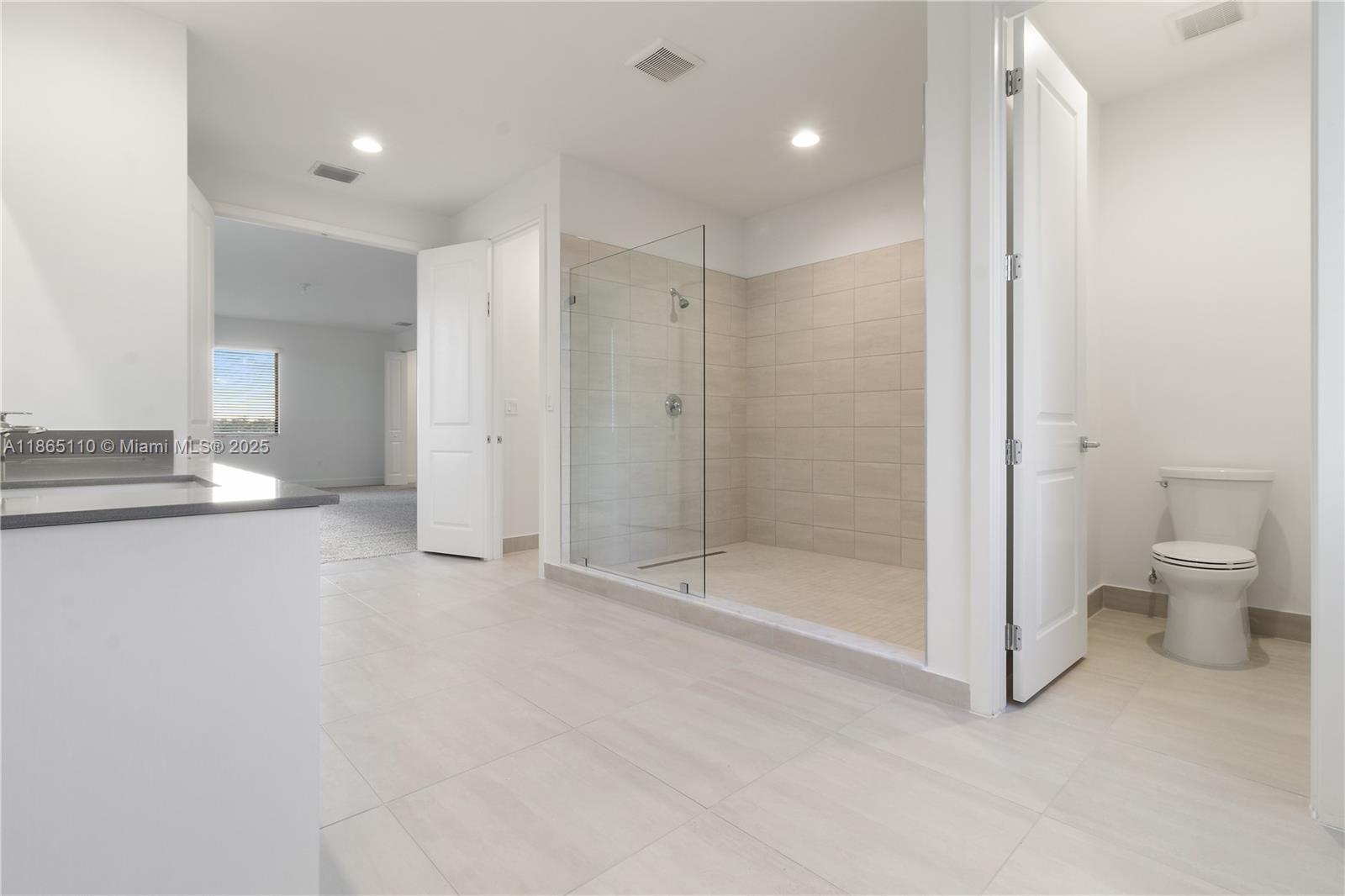 2391 Southwest 123rd Terrace Davie, FL 33325 - Photo 34 of 39 a bathroom with a shower and a toilet